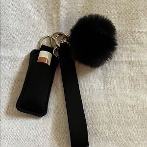 Elegant Black Keychain with Pom Pom and Lip Balm Holder